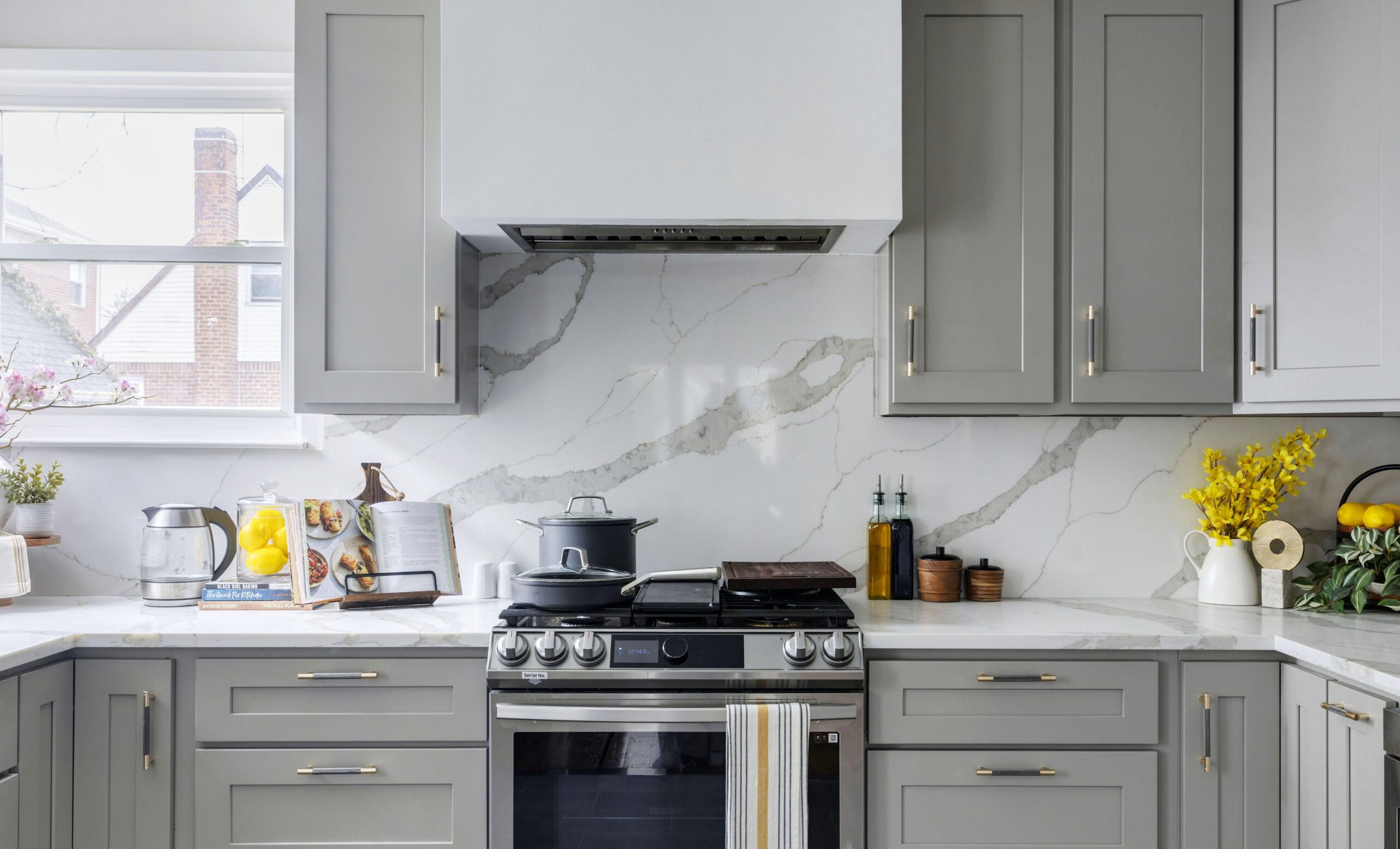 Luxury kitchen backsplash with handmade subway tile and brass shelf