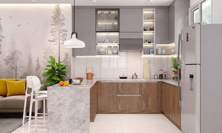 Transitional luxury kitchen with cream cabinetry and marble backsplash